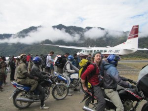 Go-Jek, motorcycle taxi outside Sugapa Village as we leave for our Carstensz Pyramid climb and expedition trekking