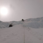 Todd above his second screw on the headwall